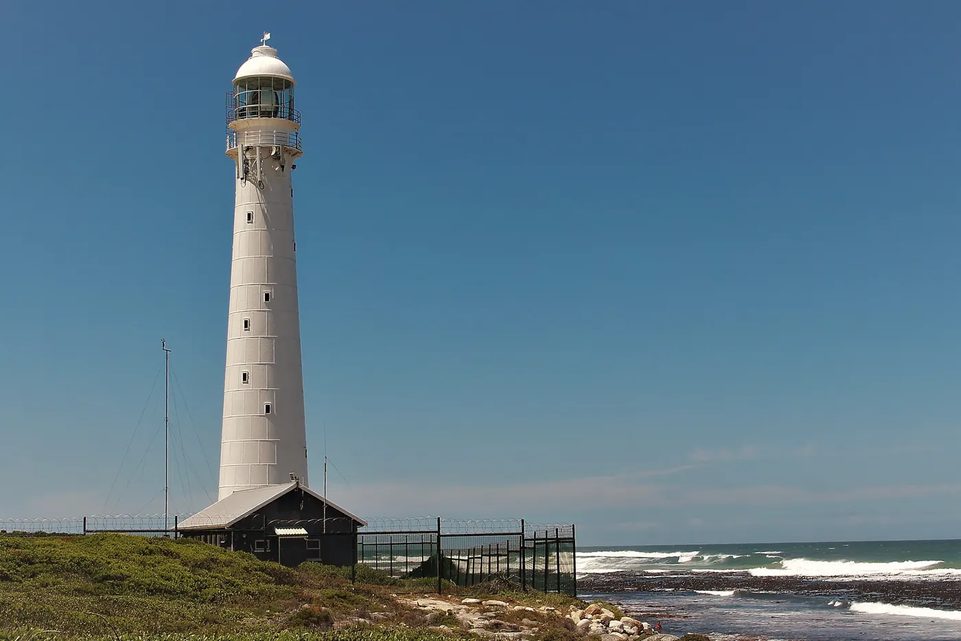 A white lighthouse on the coast near Cape Town
